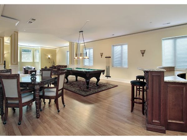 Picture with basement ideas including a pool table, bar, and dining area