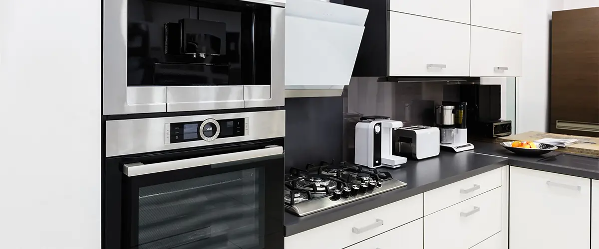 Kitchen appliances in a black and white space