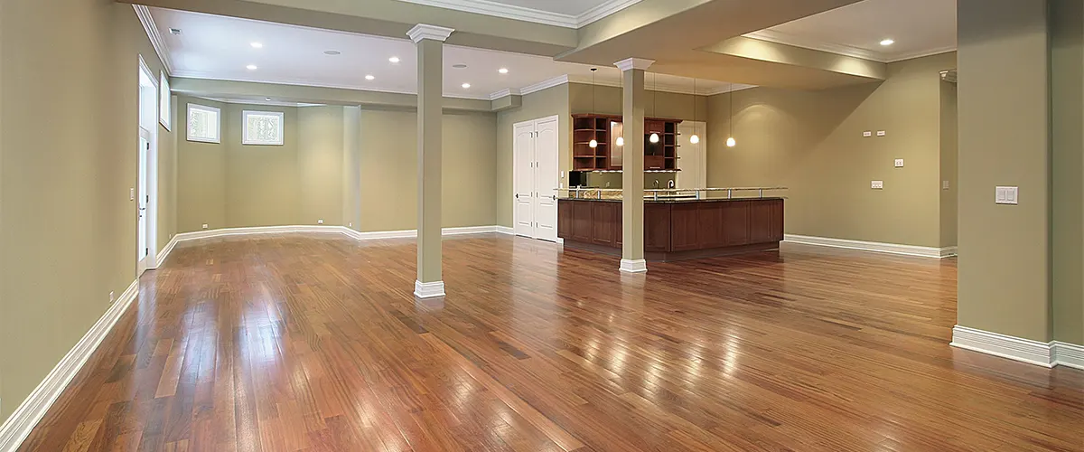 New, empty basement with wood flooring