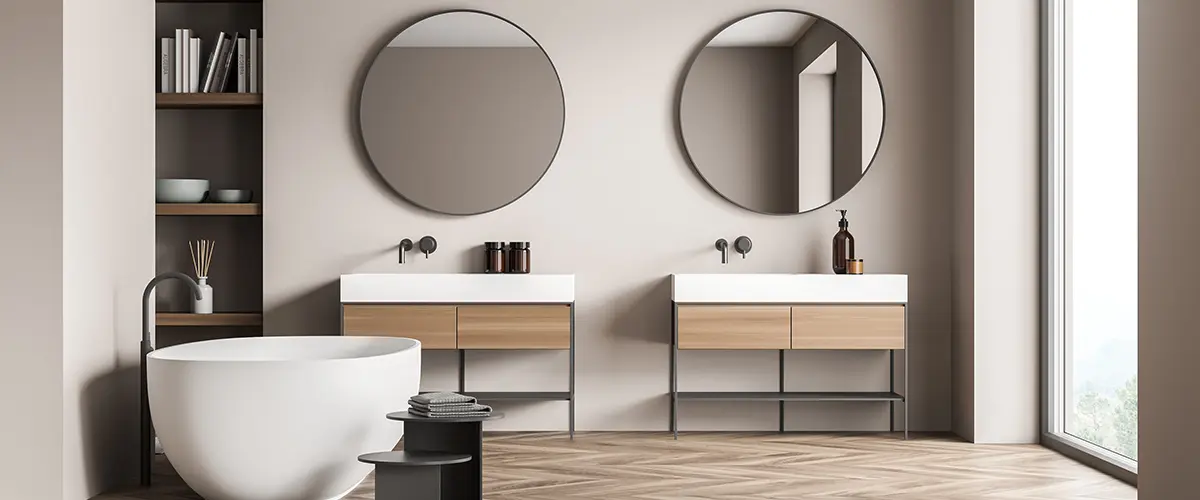 An upscale bathroom remodel with wood flooring and simple vanities