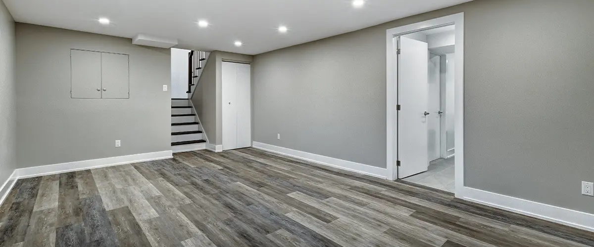 An empty basement with LVP flooring