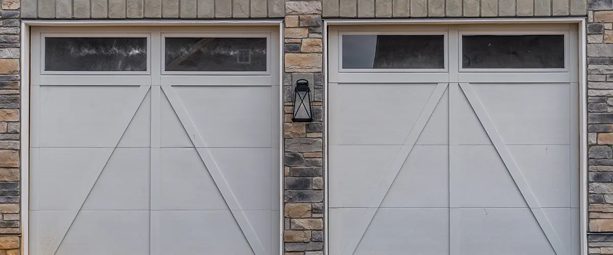 Double garage doors with stone veneer
