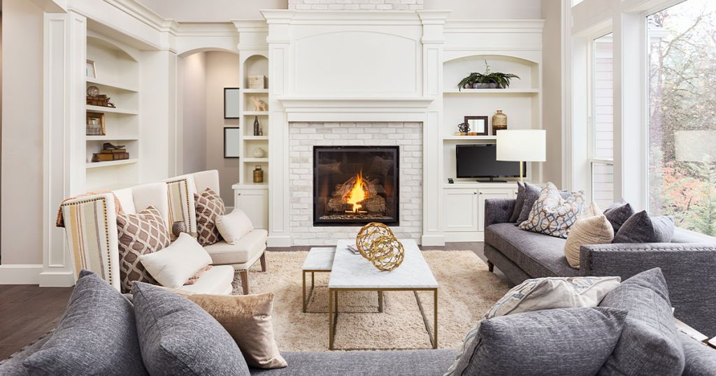Make your house look luxurious with a fireplace, crown molding, and neutral colors