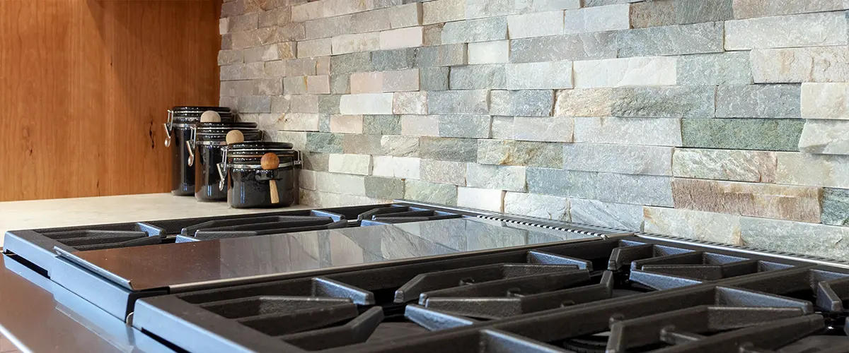 Stone slate backsplash with a kitchen range