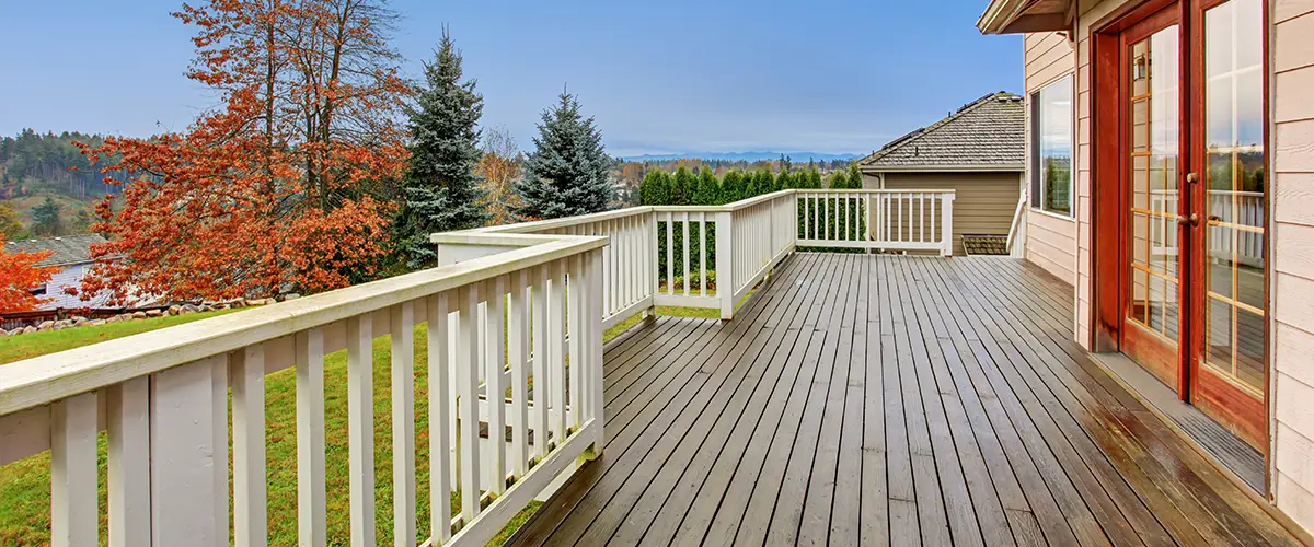Wood deck with white wood railings