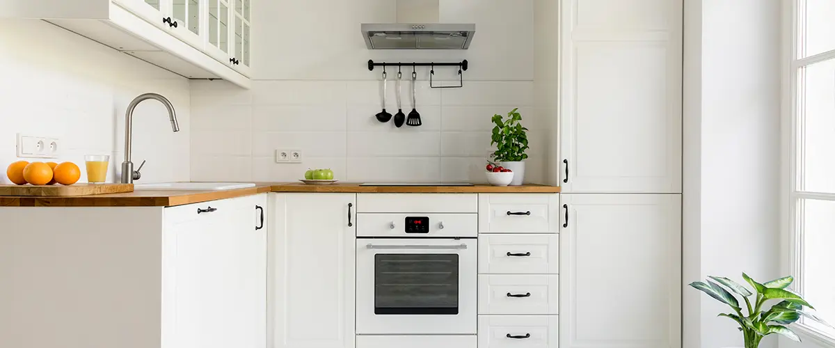 Simple white cabinets with dark pulls