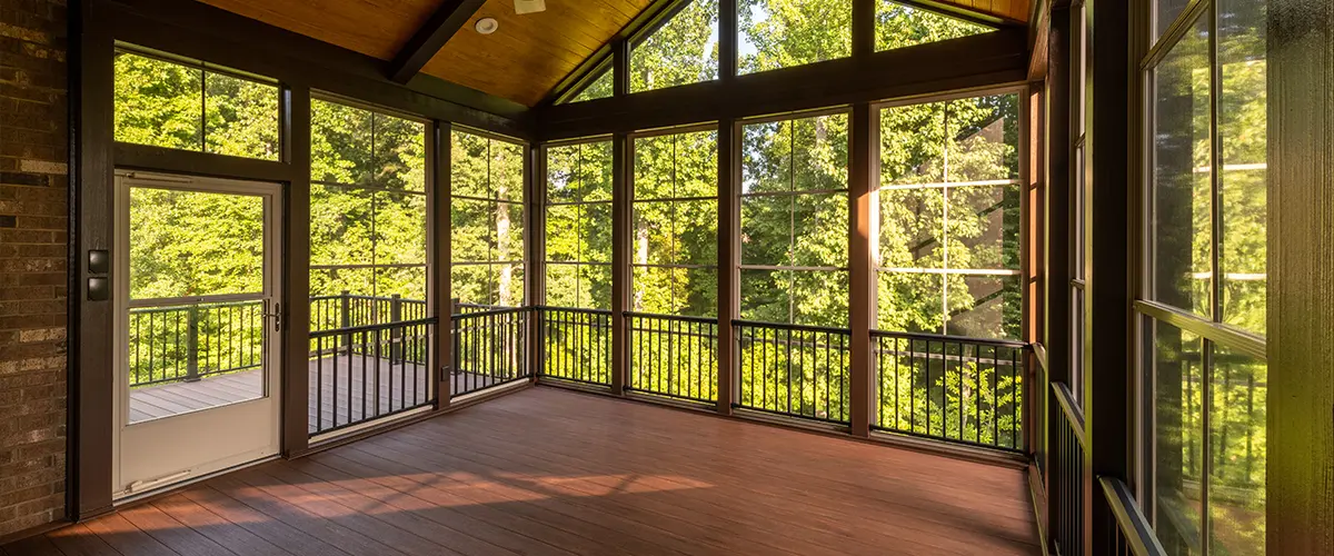 Wood sunroom with large window frames