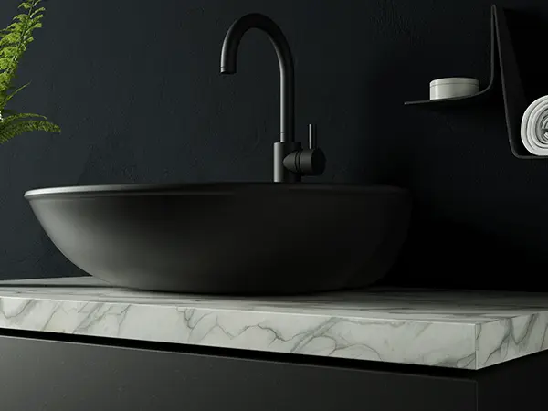 Quartz countertop with a dark sink and faucet