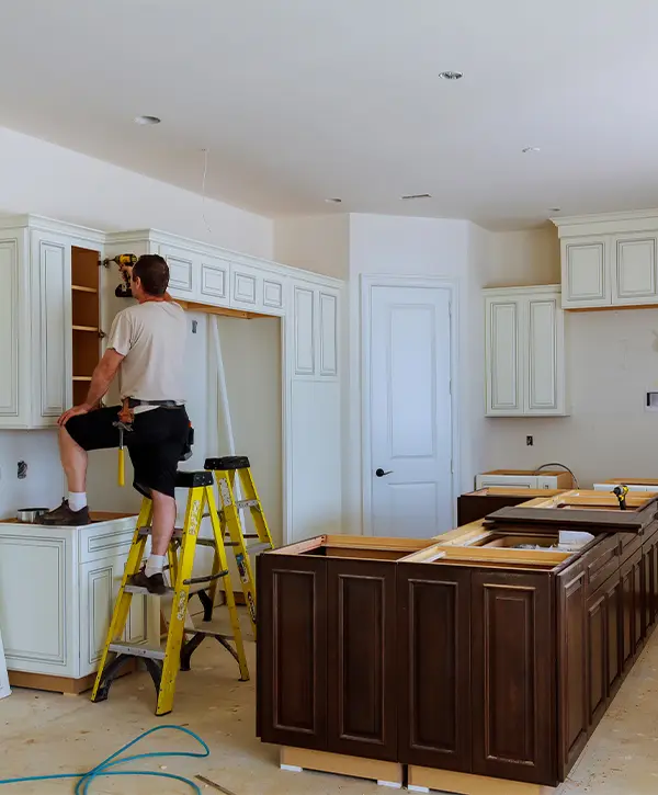 Kitchen remodeling companies working on kitchen cabinets