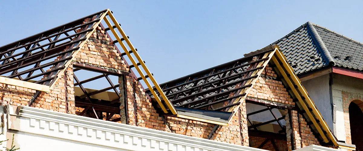 Second story home addition with brick walls and roof