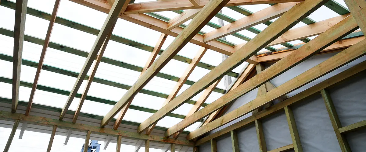 A wood frame roof for a sunroom